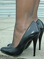 business woman in stilettos and tights