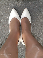 secretary in platforms and pantyhose